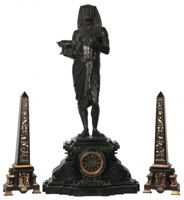 This large marble and bronze three-piece Egyptian Revival clock set will be sold Oct.  19th.