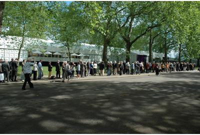 Queues outside Art Antiques London, Kensington Gardens, London waiting for entrance to the fair