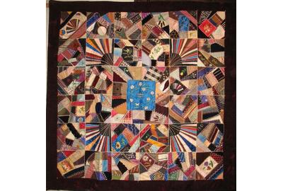 Persian blue medallion with floral embroidery crazy quilt.