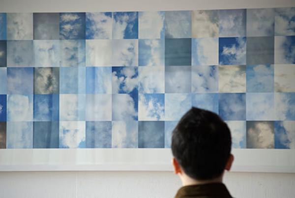 Shinseungback Kimyonghun, “Cloud Face,” 2012.  Pigment print on cotton rag paper, 78 3/4 x 31 1/2” (installation view).  Courtesy of the artists.