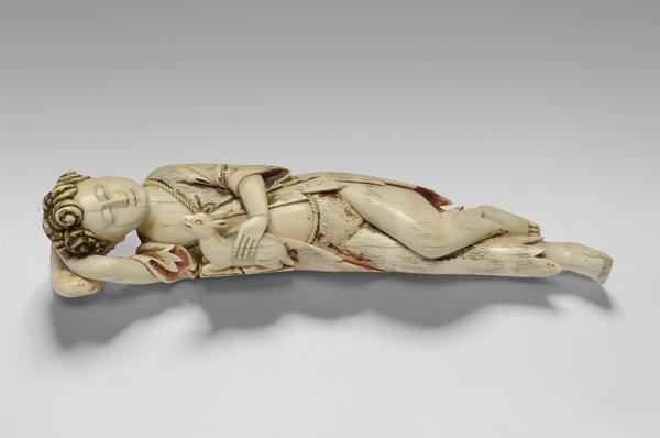 Christ Child as the Good Shepherd, 17th century.  Artist/maker unknown, Ceylon-Portuguese.  Ivory with polychromy, 2 1/4 x 11 x 2 3/4 inches (5.7 x 27.9 x 7 cm).  Roberta and Richard Huber Collection.