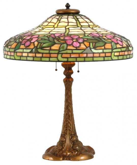 Duffner & Kimberly table lamp with 20-inch diameter leaded shade having a green and caramel slag background, 24 inches tall (est.  $4,000-$6,000).