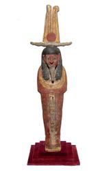 Egyptian polychrome Ptah-Sokar-Osiris from the Late Period (circa 1075-974 BC), depicted mummiform on a rectangular integral base, wearing a tripartite headdress (est.  $6,000-$9,000).