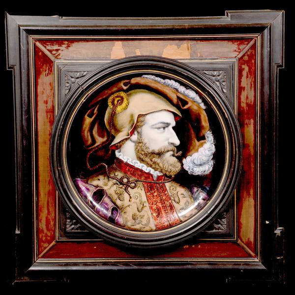 One of a pair of French enamel on copper round portrait plaques, this one of a Renaissance man, the other of a woman.