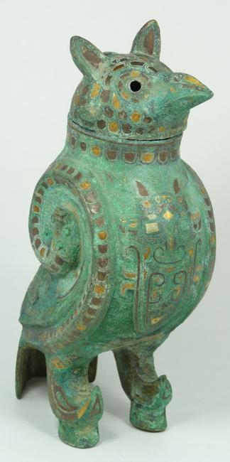 Rare bird-shaped bronze wine container inlaid with silver, copper and gold (est.  $200,000-$300,000).