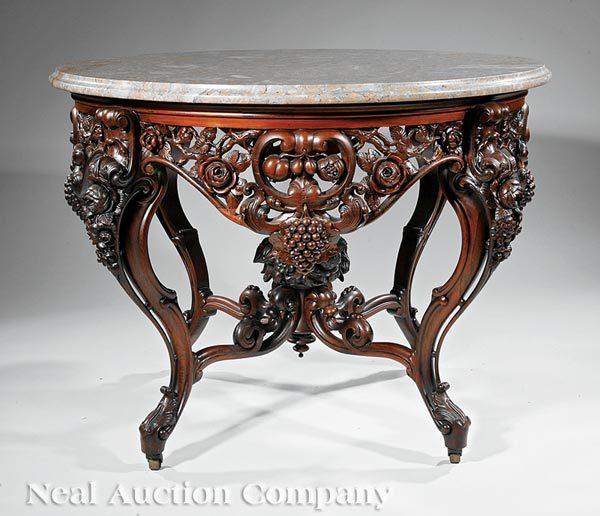 Lot 157, a rare, American Rococo carved and laminated rosewood center table attributed to John Henry Belter.  Made c.  1850-60, this table closely relates to the example Belter constructed for the Lincoln bedroom at the White House.  The center table more than doubled its pre-sale low estimate of $25,000, selling for $86,637.00.