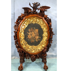 Rare, museum-quality rococo rosewood fire screen in mint condition, the finest piece of Victorian rococo Stevens Auction has seen in 40 years, 55 inches tall (est.  $15,000-$30,000).