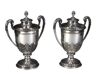 This large pair of German .800 silver covered urns, from the late 19th century, stands 17 ½ inches tall and weighs a total of 120.45 troy oz.  (est.  $1,500-$2,500).