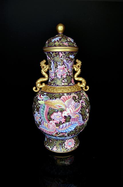 Lot 200 is this magnificent Famille-Rose Enameled & Gilt Butterfly Vase.  Of the Qing Dynasty Period with the Qianlong Six Character Mark.  Height: 13 ½ in 