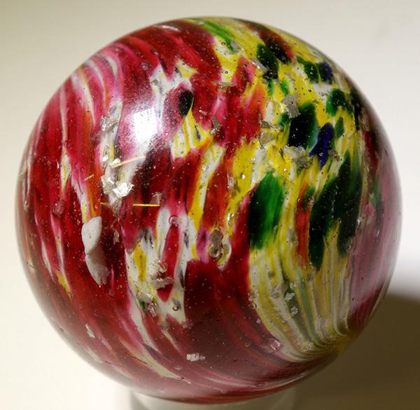 Giant onion skin marble with mica, circa 1860s-1880s, two inches in diameter, a beautiful specimen with multi-colored splotches and mica flakes scattered throughout the body ($1,475).