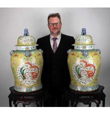 Large pair of famille jaune (yellow Chinese porcelain) dragon and phoenix ginger jars with foo dog finials on the lid, 14 inches tall (est.  $2,000-$4,000).