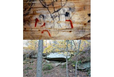 One of 290+ prehistoric glyphs on the cave walls of Picture Cave.  This example shows Anthropomorphs with red sashes and accents and a Cave entrance.