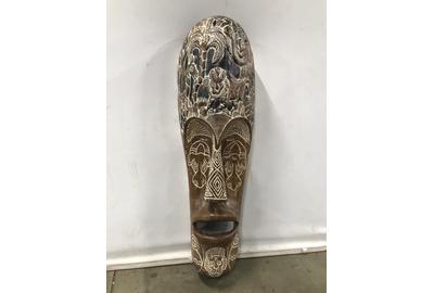 This oversized African carved wood mask ($300/1,500) from the Bobo in Burkina Faso or the Fang peoples in Cameroon has etched motifs of varying animals, 49 by 16 ¼ by 11 inches.