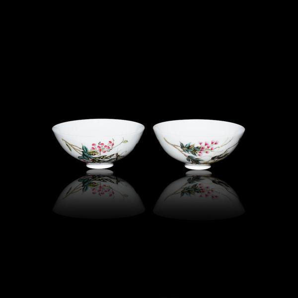 A pair of Qing Dynasty Famille-Rose Floral Bowls with Grasshoppers amidst blossoms on one and pea pods on the other.  Each is inscribed with a poem.  Lot 190.  $1,000,000-$1,500,000.