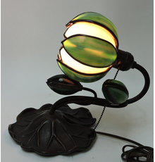 Handel bronze desk lamp modeled with a large lily pad base and stem holding leaded glass bud and lighted water lily lamp, 10 ½ inches tall (est.  $300-$500).