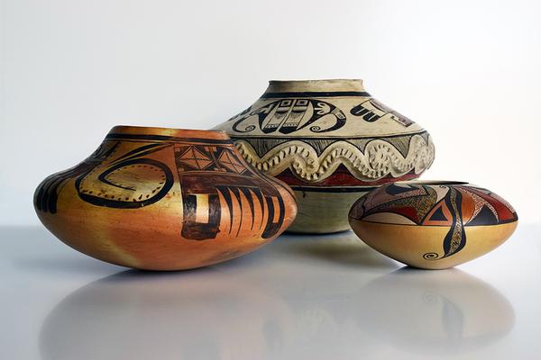 Photo by Bill Dambrova.  Ceramics (L-R): Nampeyo (Hopi/Tewa, c.  1860-1942), "Unchained Melody Jar," c.  1905-1907, and "Polychrome Storage Jar with Appliqué," c.  1905; Les Namingha (Hopi/Zuni, b.  1967), "Jar," c.  1997.  Gifts of The Allan and Judith Cooke Collection.  