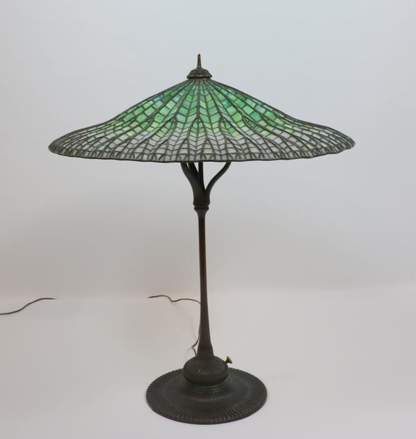 From an important New York City collection comes a Tiffany table lamp with “Lotus” shade, signed ($125/225,000), 14 inches tall.