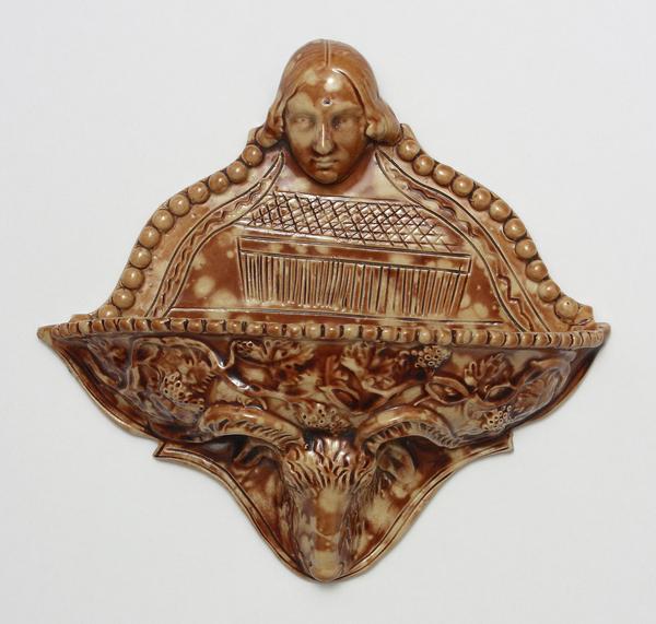 A wall-pocket piece of pottery signed by Thomas H.  Personette and dated March 6 1860