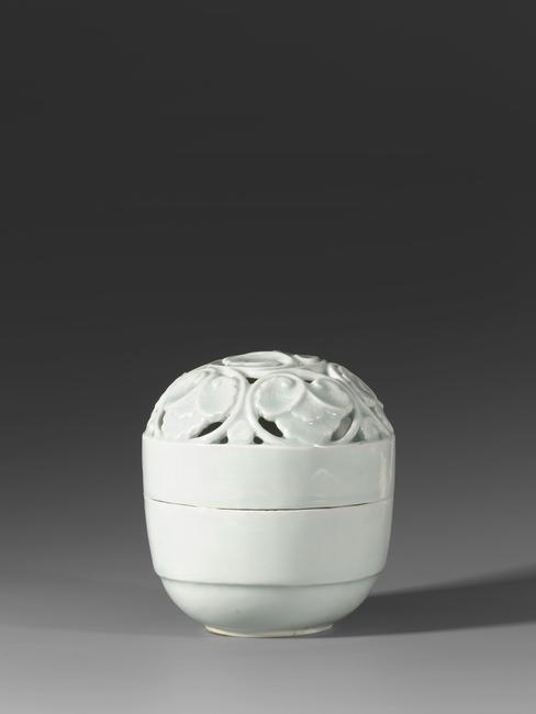 A Qingbai-glazed porcelain incense burner with carved openwork top.  Made early in the Song period, in the 11th century, Height 4 7/8 inches