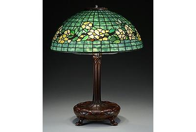 This Tiffany Studios Belted Dogwood table lamp is being offered at auction by James D.  Julia on June 18, 2015, with online bidding offered by Invaluable.com.