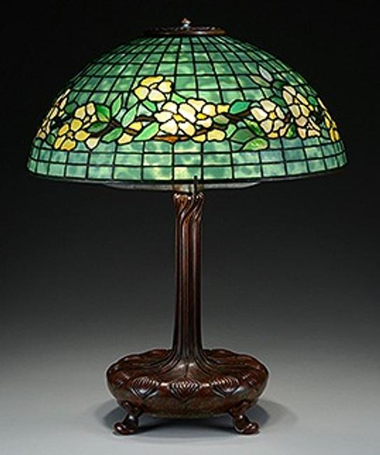 This Tiffany Studios Belted Dogwood table lamp is being offered at auction by James D.  Julia on June 18, 2015, with online bidding offered by Invaluable.com.