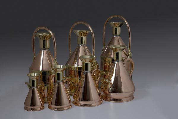 SEVEN COPPER AND BRASS PETROL MEASURES ..BY GASKELL & CHAMBERS LTD., BIRMINGHAM, EARLY 20TH CENTURY.  