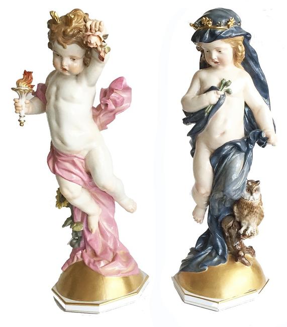 German Meissen porcelain pair of Putti figures Emblematic of Night and Day, modeled by Heinrich Schwabe, 1877-1880, each standing atop a gilt semi-circle symbolizing the sun.  Marked with blue crossed swords, day incised L134 and night incised L135.Circa 1880.  21 1/8” and 21 1/2” H.  $31,500.