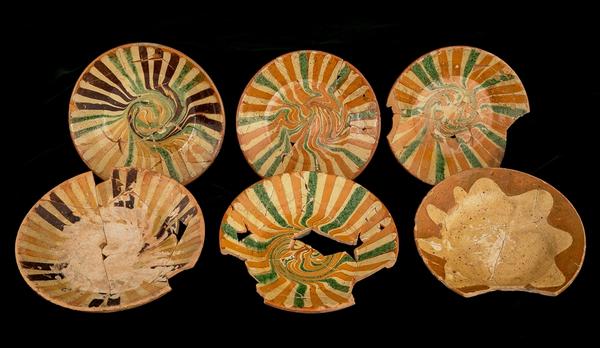 Decorative items from a remarkable assemblage of 18th-century slipware ceramics uncovered during an archaeological excavation in Philadelphia.  Photo courtesy of Robert Hunter