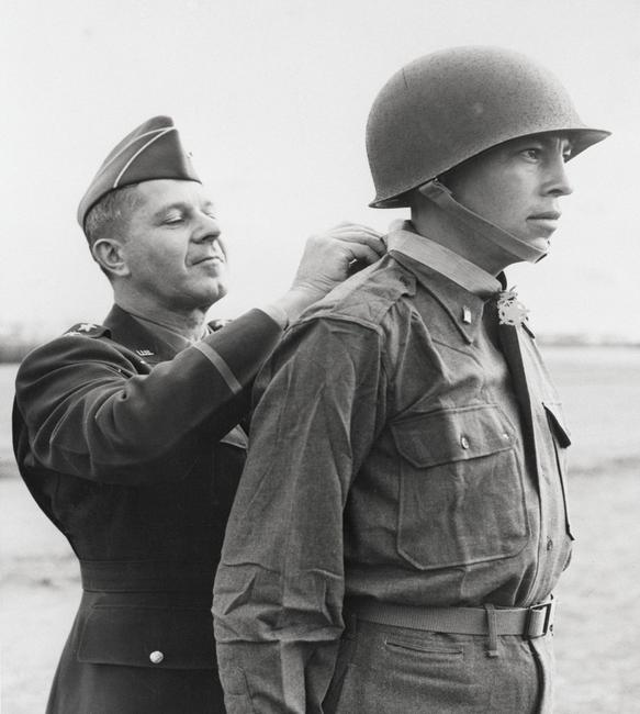 Ernest Childers (Muscogee [Creek]) receives the Congressional Medal of Honor from Lieutenant General Jacob L.  Devers (left).  5th Army headquarters, April 8, 1944.  