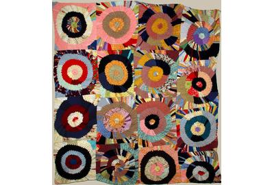 ‘TARGETS’ VINTAGE PIECED QUILT- circles of folded layered triangles resembling a Sonia Delauney.