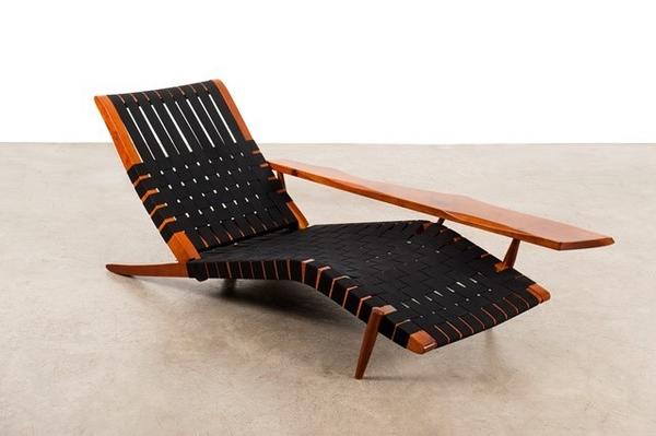 George Nakashima (1905-1990) Long chair, 1947.  Walnut and textile, €60,000-80,000.  