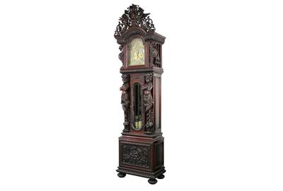 The top lot of the auction at $90,750 was this R.J.  Horner mahogany grandfather clock with J.J.  Elliott nine-tube works, heavily carved with winged griffins, pierced carved angel crest, flowers, foliage and birds.  It stands 118 1/2 inches tall.