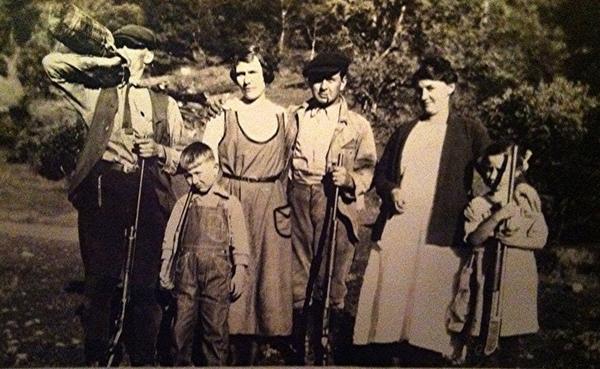 Sam Kerbey, pioneer gun collector, center, and Russell Kerbey, who inherited the gun collection, as a young boy, far left.  