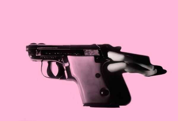 Laurie Simmons, Lying Gun/Pink, 2014.  Pigment Print, 20 5/8 x 30 inches.  Edition of 10, each in a unique color.  