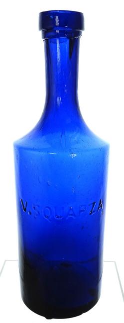 V.  Squarza bitters bottle with applied mouth, in a beautiful cobalt blue (S 170).  It’s only the second one American Bottle Auctions has ever sold and its condition (9) is near perfect.  