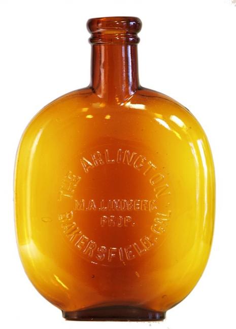 The Arlington (M.A.  Lindberg, Prop., Bakersfield, Calif.) pint pumpkinseed flask, one of only two Western pumpkinseed flasks found in this color (est.  $1,000-$2,000).