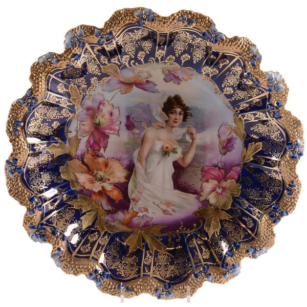 Marked R.S.  Prussia plate, 11.75 inches in diameter, stipple mold, with a fall season portrait decor having poppy highlights and a wonderful cobalt blue border.