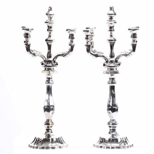 Pair of silver, five-arm candelabra having an 800/1000 silver purity mark and a hallmark indicating the Austria-Hungary Empire (1866-1937), each one 27 ½ inches tall.