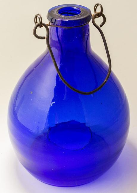 This scarce and fun cobalt blue flycatcher bottle with the original hanger sold for a very reasonable $527 -- not bad for a bottle with zero embossing.