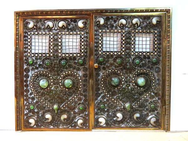 This gorgeous Moorish bronze jeweled fire screen, attributed to Tiffany Studios, sold for $60,000.