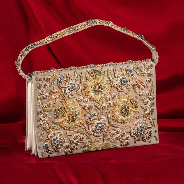 Precious gem beaded evening purse encrusted with 118 rubies, 106 sapphires and 72 emeralds, having gold and silver foil wrapped thread (est.  $2,000-$4,000).