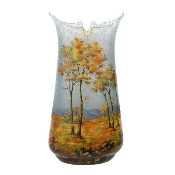 Signed Daum Nancy French cameo art glass vase, 9 ¾ inches tall, having a beautiful blue and white mottled ground with a cameo acid cut tree, field and mountain scenic décor ($10,925).