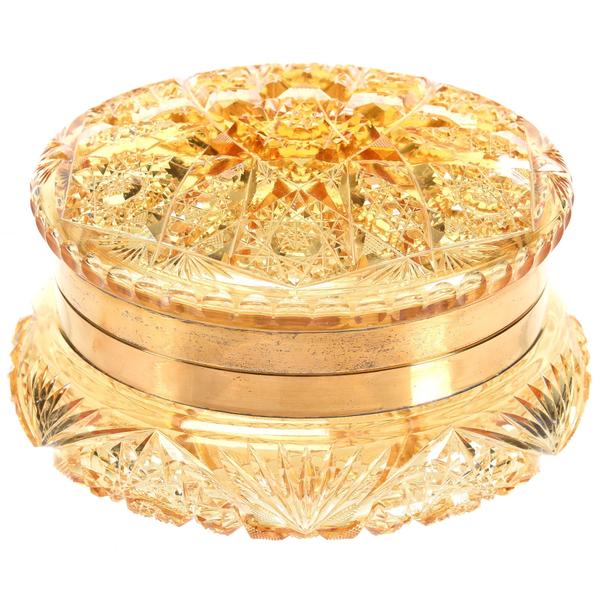 ABCG round dresser box in a solid gold color with gilt metal fittings, attributed to Union Cut Glass and purchased from the Julian De Cordova Museum in Lincoln, Mass, 3 ½ inches by 6 ¼ inches.  