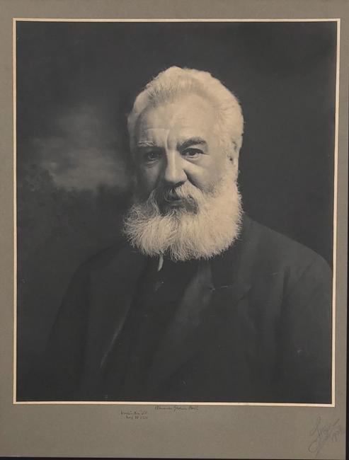 Large photographic image of Alexander Graham Bell, on a mount of 32 inches by 24 inches, signed in fountain pen, “Washington, D.C., May 18, 1921, Alexander Graham Bell.” 