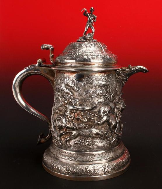 Gorgeous circa 1860s English repousse silver pitcher by R&S Garrand of London, with marks dating it to London around 1861, 8 inches tall (est.  $4,000-$6,000).