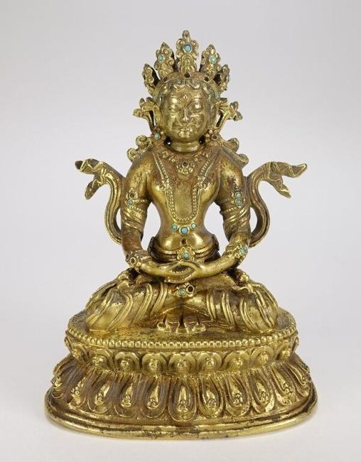 19th century Tibeto-Chinese gilt bronze figure of a seated White Tara, diminutive at 5 inches tall (est.  $2,000-$3,000).