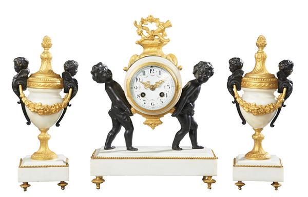 Early 20th century French gilt and patinated three-piece antique clock set by F.  Pelissier (est.  $500-$900).