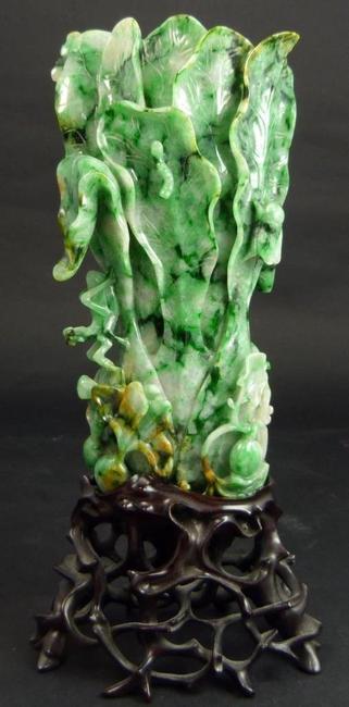 This Chinese late Qing Dynasty carved jadeite cabbage vase, not quite 7 inches tall, sold for $59,520 at Elite Decorative Arts' April 11th auction in Florida.