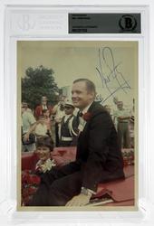 Signed photograph of Neil Armstrong, 5 inches by 7 inches, authenticated and encapsulated by Beckett Authentication Services (est.  $400-$500).