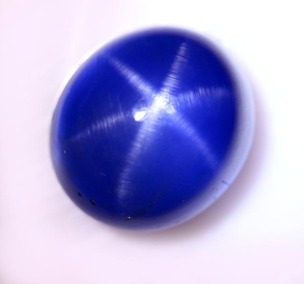 Lot 49: A Oval Cabochon Standard Cut Natural Blue Star Sapphire